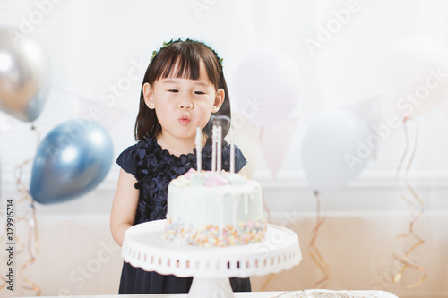 toddler girl celebrating her 4th birthday at home