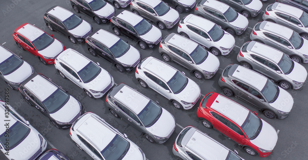 Fototapeta premium Car Dealer Logistics Center, new cars parked. Drone view.