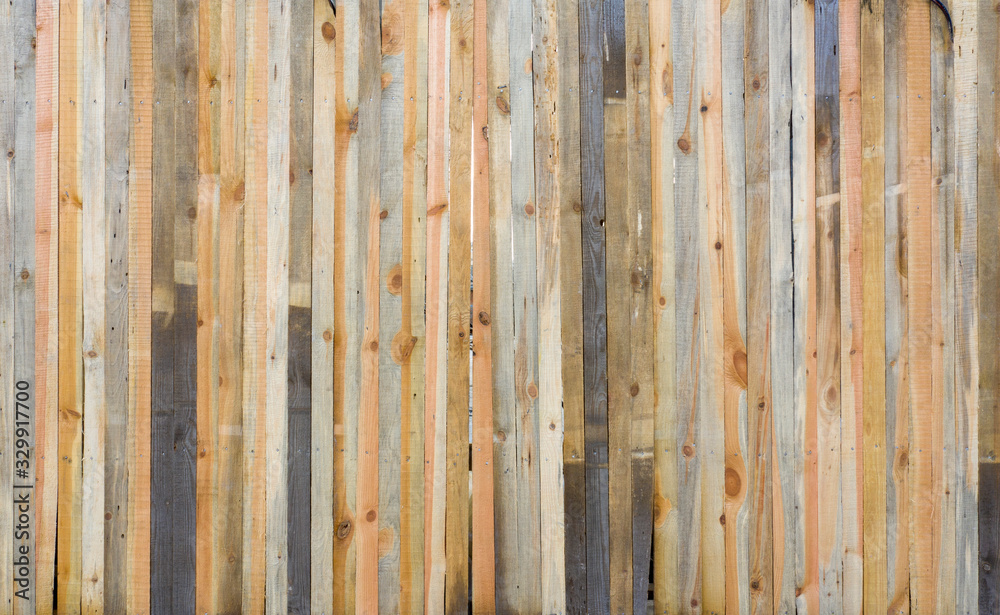 Brown wooden wall with vertical boards texture. Brown wooden wall with vertical boards texture.