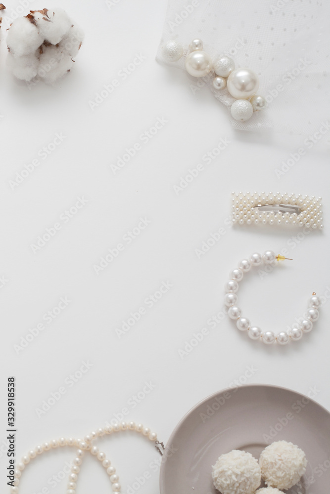 The wedding background with space for text, decorated with invitation envelopes and decorations for the bride, is made in soft pastel colors, with copy space. Conceptual backgrounds for wedding texts. The wedding background with space for text, decorated with invitation envelopes and decorations for the bride, is made in soft pastel colors, with copy space. Conceptual backgrounds for wedding texts.