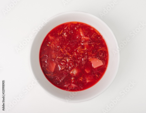 Fresh beetroot soup isolated on white background