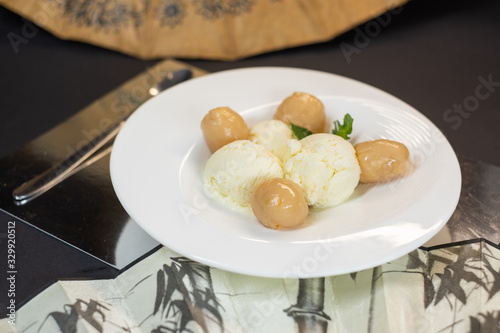 Icecream with lychee fruits in chineese style photo