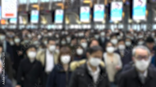 Wallpaper Mural TOKYO, JAPAN - MARCH 2020 : Crowd of people walking at Shinagawa station in morning rush hour. Many commuters going to work. People wearing mask to protect from Coronavirus(COVID-19). Blurred shot. Torontodigital.ca