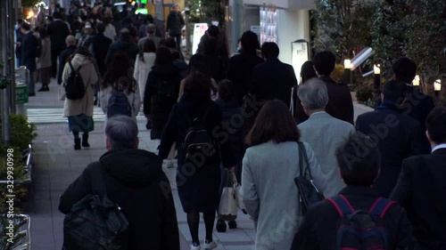 Wallpaper Mural TOKYO, JAPAN - MARCH 2020 : Crowd of people walking down the street in busy rush hour. Many commuters after work at night. Japanese business man and woman, job and lifestyle concept. Slow motion. Torontodigital.ca