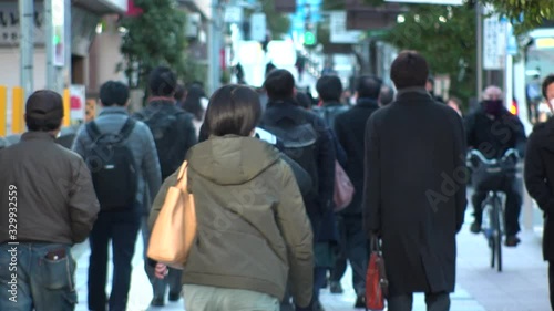 Wallpaper Mural TOKYO, JAPAN - MARCH 2020 : View of crowd of people walking down the street in busy morning rush hour. Many commuters going to work. Japanese business, job and lifestyle concept. Slow motion shot. Torontodigital.ca