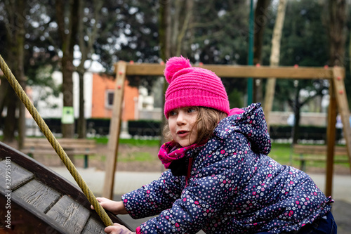 cute little girl on the playground photo