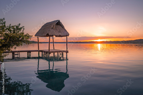 Sunset view from a a pier in Bacalar Lagoon, near Cancun in Riviera Maya, Mexico