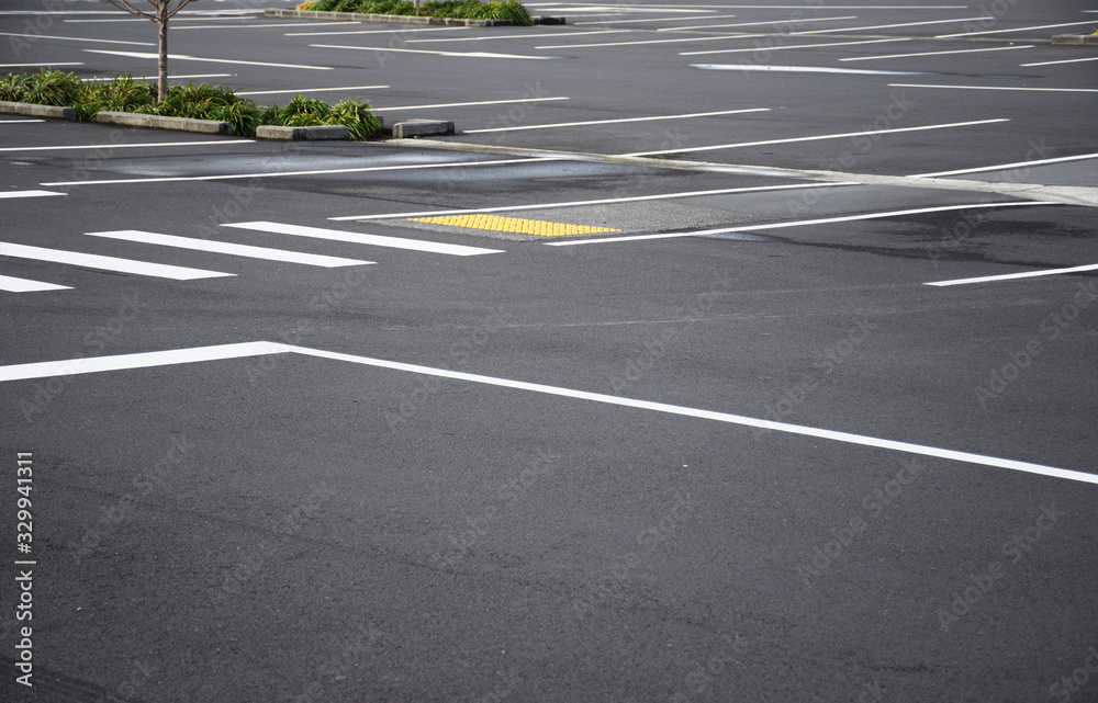 Large empty car park with white painted lines