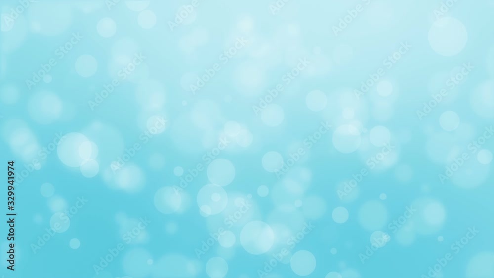 Animated light turquoise blue bokeh background with floating light particles.