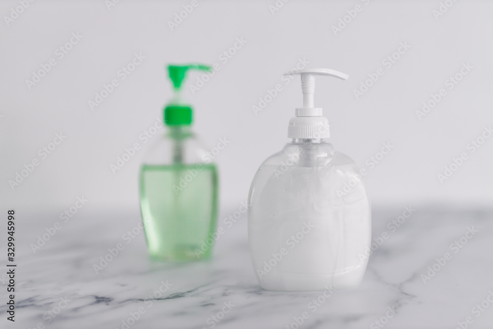 hygiene against viruses and bacteria, hand sanitizer and liquid soap bottle on marble bathroom hygiene against viruses and bacteria, hand sanitizer and liquid soap bottle on marble bathroom