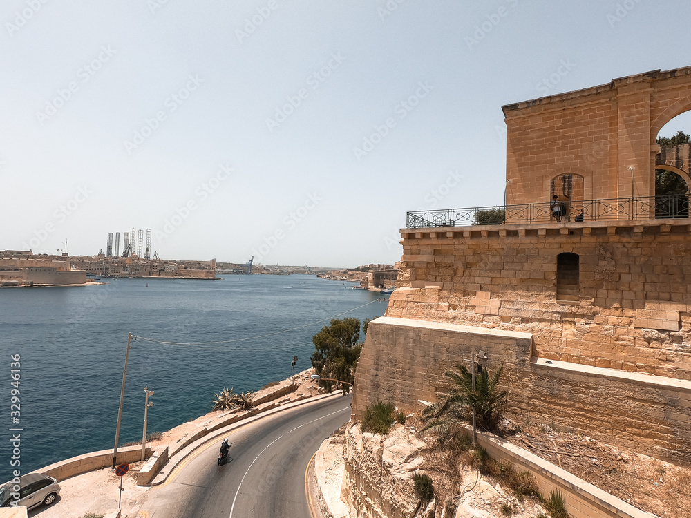 Coast of Valletta, Malta. Old streets and the Mediterranean sea are appreciated in the background.