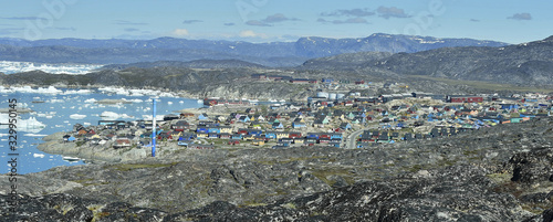 View from a nearby hill, overlooking the town of Illulisat, West Greenland . © Uryadnikov Sergey