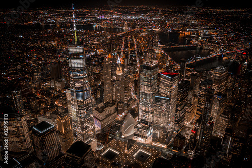 Aerial view of NewYork City and downtown skyline from Hudson River at night