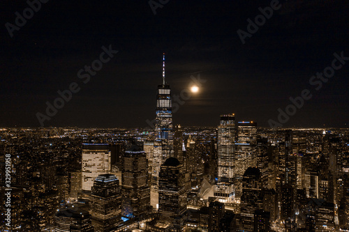 Aerial view of NewYork City and downtown skyline from Hudson River at night