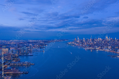 Skyline of NewYork City and Jersey City from Hudson River at dusk