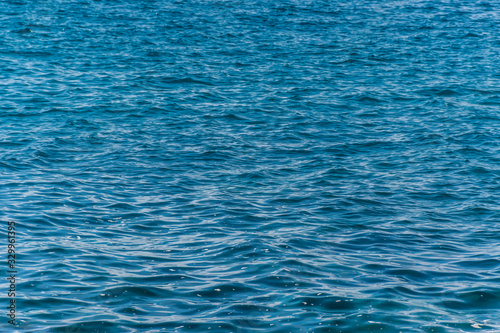 A close-up shot of the Mediterranean Sea waves and the turquoise water