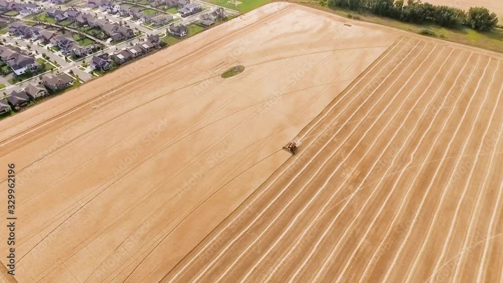 A combine harvesting grain in slow motion A combine harvesting grain in slow motion