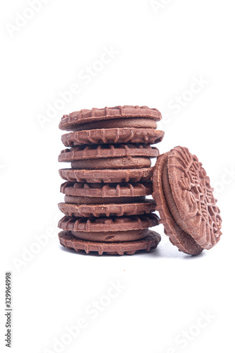A picture of homemade chocolate cream biscuits on isolated white background.