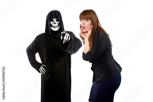 Fotografie Scared businesswoman paranoid of catching a deadly disease represented by the grim reaper