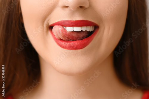 Beautiful young woman with bright lips  closeup