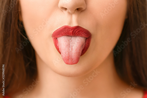 Emotional young woman showi...