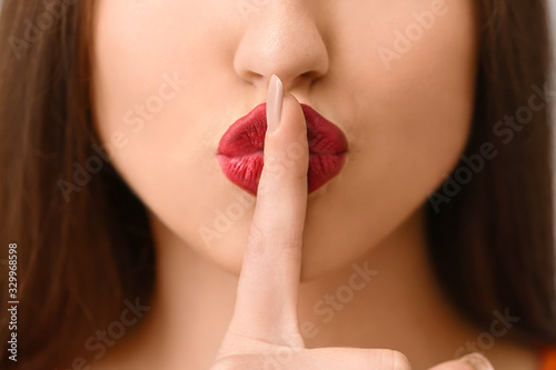 Emotional young woman showi...
