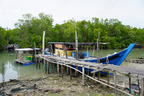 Wallpaper Mural Pulau Ketam is in the intertidal zone and the chief vegetation is mangrove with fishing boat around. Torontodigital.ca