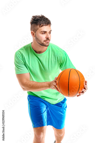 Sporty young man with ball ...