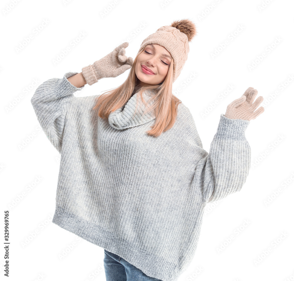 Young woman in warm sweater, hat and gloves on white background Young woman in warm sweater, hat and gloves on white background