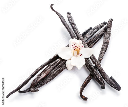 Aromatic vanilla sticks on white background photo