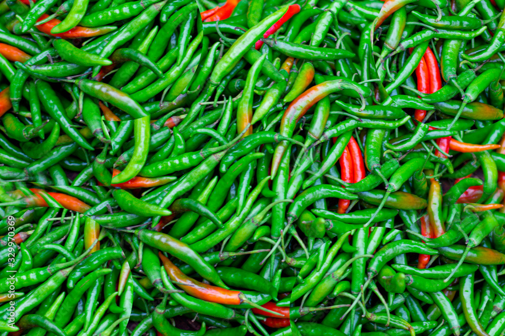 Close up image of a pile of fresh Thai green and red paprika sold in fresh market. Close up image of a pile of fresh Thai green and red paprika sold in fresh market.