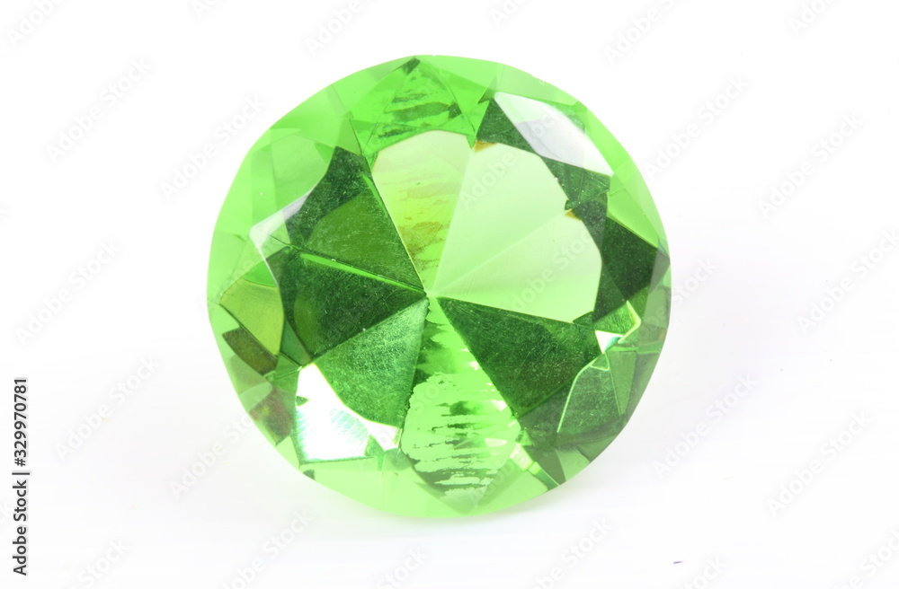 Green diamond on white surface Green diamond on white surface