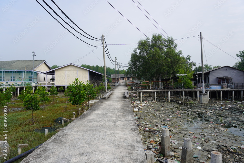Plastic bags, bottles, construction debris, planks, and styrofoam boxes, strewn all over Pulau Ketam and turn to marine debris.