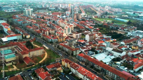 Zoom in aerial shot of Aveiro Portugal, red roofs residential and commercial districts