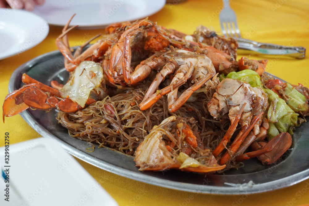 Chinese fried rice thin noodles with black soy sauce and fresh crab. Chinese fried rice thin noodles with black soy sauce and fresh crab.