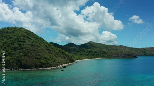 Wallpaper Mural Wonderful Scenery Of Green Lush Mountain In Fiji Island With Calm Ocean and Green Trees Under The Bright Blue Sky Above - Wide Shot Torontodigital.ca
