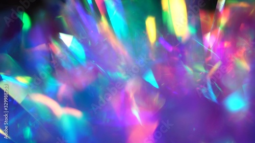 Neon, pink, purple, blue colors abstract vibrant iridescent background. Light through a crystal prism