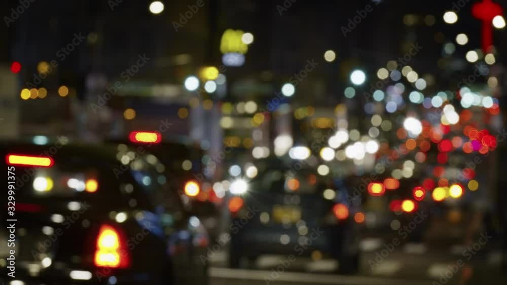Urban NYC abstract scenery with colorful lights and blurry street traffic, unrecognizable commuting cars, night time Urban NYC abstract scenery with colorful lights and blurry street traffic, unrecognizable commuting cars, night time