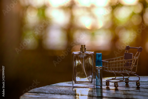 Close-up view of the water bottle placed on the table, the bokeh light of the beautiful evening light, the business concept of selling text products © bangprik