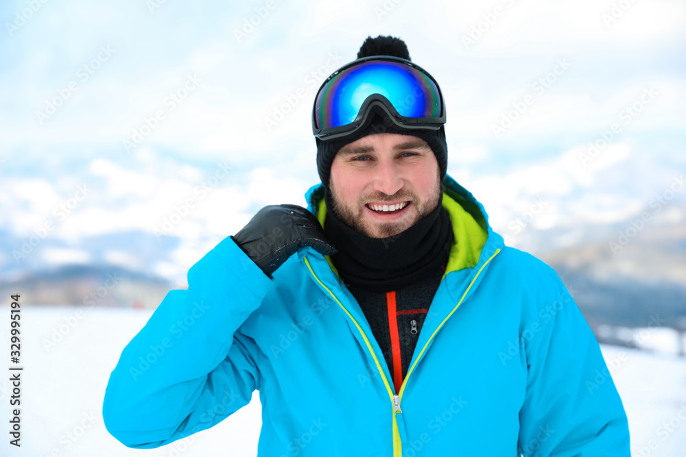 Young man at mountain resort. Winter vacation Young man at mountain resort. Winter vacation