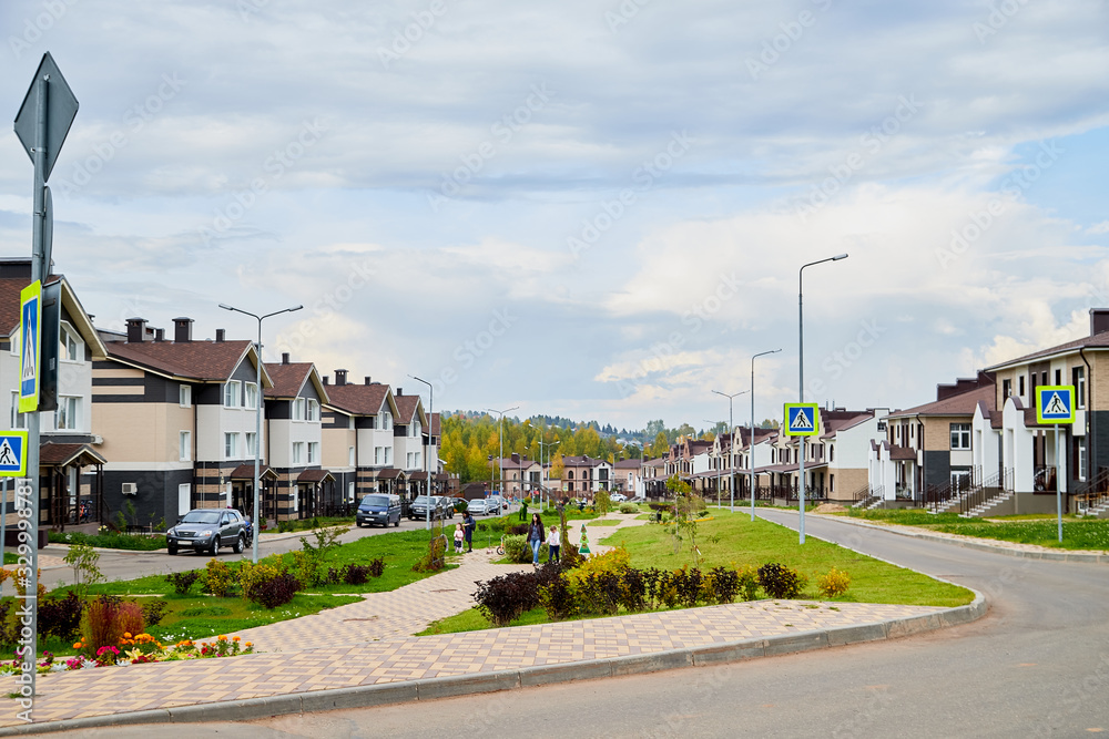 Kriov, Russi - September 08, 2019: Street in a small town, green lawn and houses in a summer