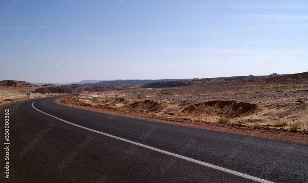 Panorama of the Sinai desert with an asphalt road. The mountains and Sands
