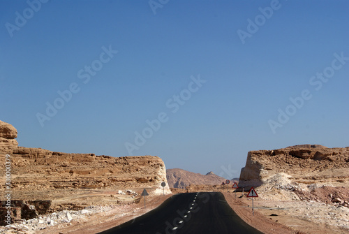 Panorama of the Sinai desert with an asphalt road. The mountains and Sands