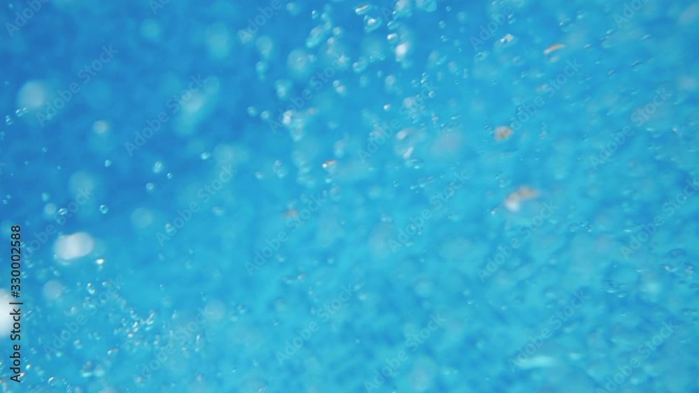Bubbles rising to the surface. Air bubbles in water in swimming pool (underwater shot), good for backgrounds. Slow motion. Bubbles rising to the surface. Air bubbles in water in swimming pool (underwater shot), good for backgrounds. Slow motion.
