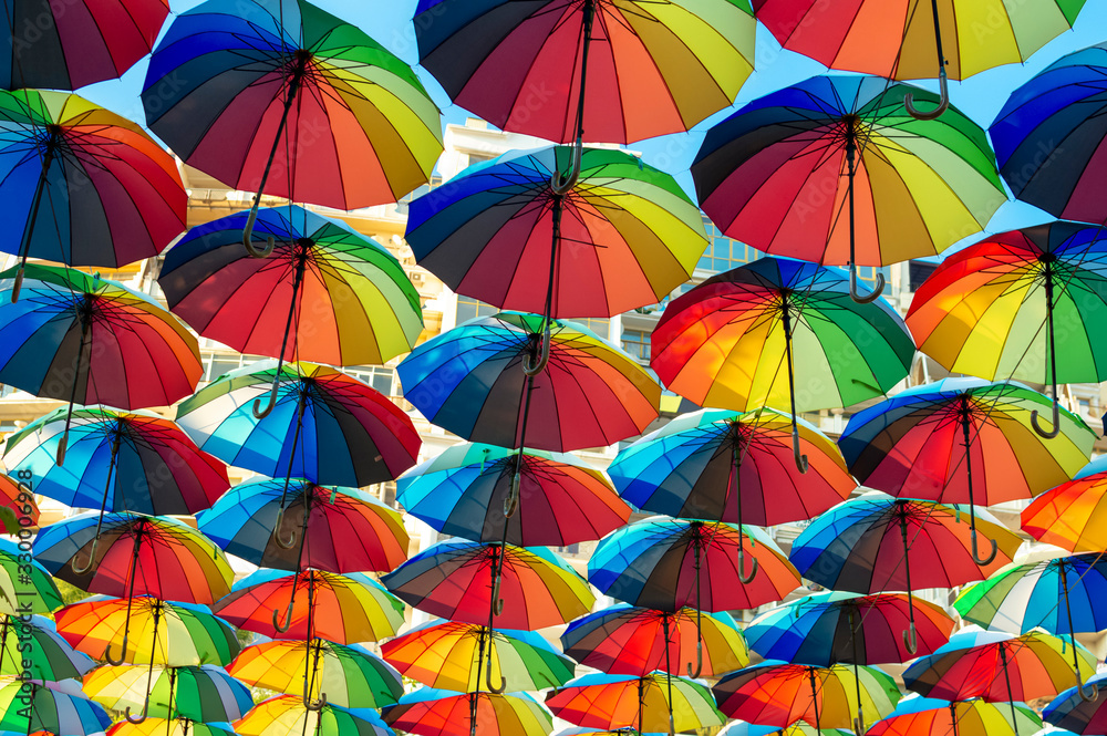 Colorful umbrellas background. Colorful umbrellas in the sky. Street decoration. Selective focus