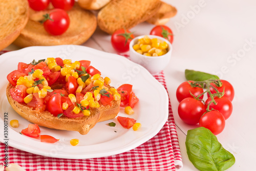 Friselle with tomatoes and mais.