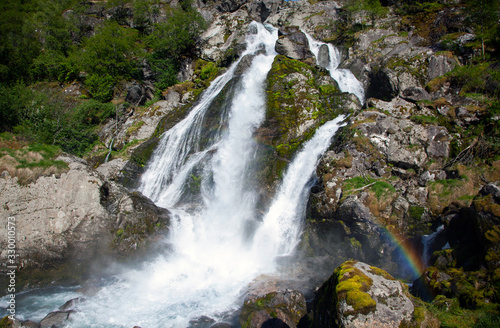 Fototapeta Naklejka Na Ścianę i Meble -  Waterfall from the Briksdalsbreen Glacier, the most popular in Norway