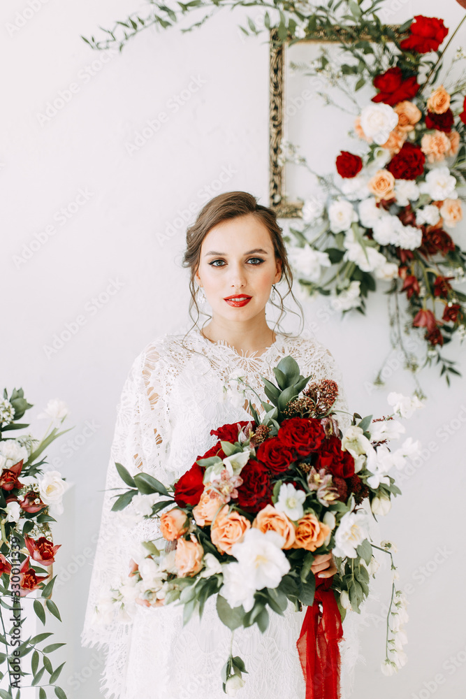 Decor of the ceremony with red roses. Portrait of the bride in the style of fine art. Wedding lace dress on the girl. Decor of the ceremony with red roses. Portrait of the bride in the style of fine art. Wedding lace dress on the girl.