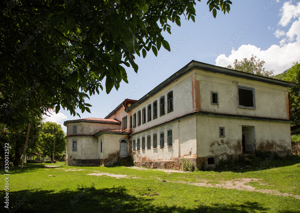 Old building among the Caucasus mountains in summer