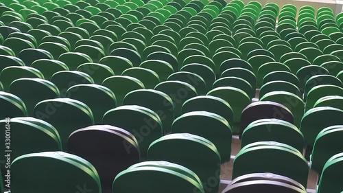 Empty plastic seats in a stadium. Matches to be played without fans.